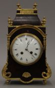 An ormolu and tortoiseshell mounted mantle clock. 33 cm high.