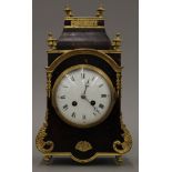 An ormolu and tortoiseshell mounted mantle clock. 33 cm high.