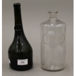 A mallet shape wine bottle with seal mark to neck and a rum bottle. The former 25 cm high.