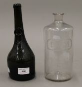 A mallet shape wine bottle with seal mark to neck and a rum bottle. The former 25 cm high.