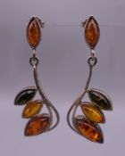 A pair of silver drop earrings. 4 cm high.
