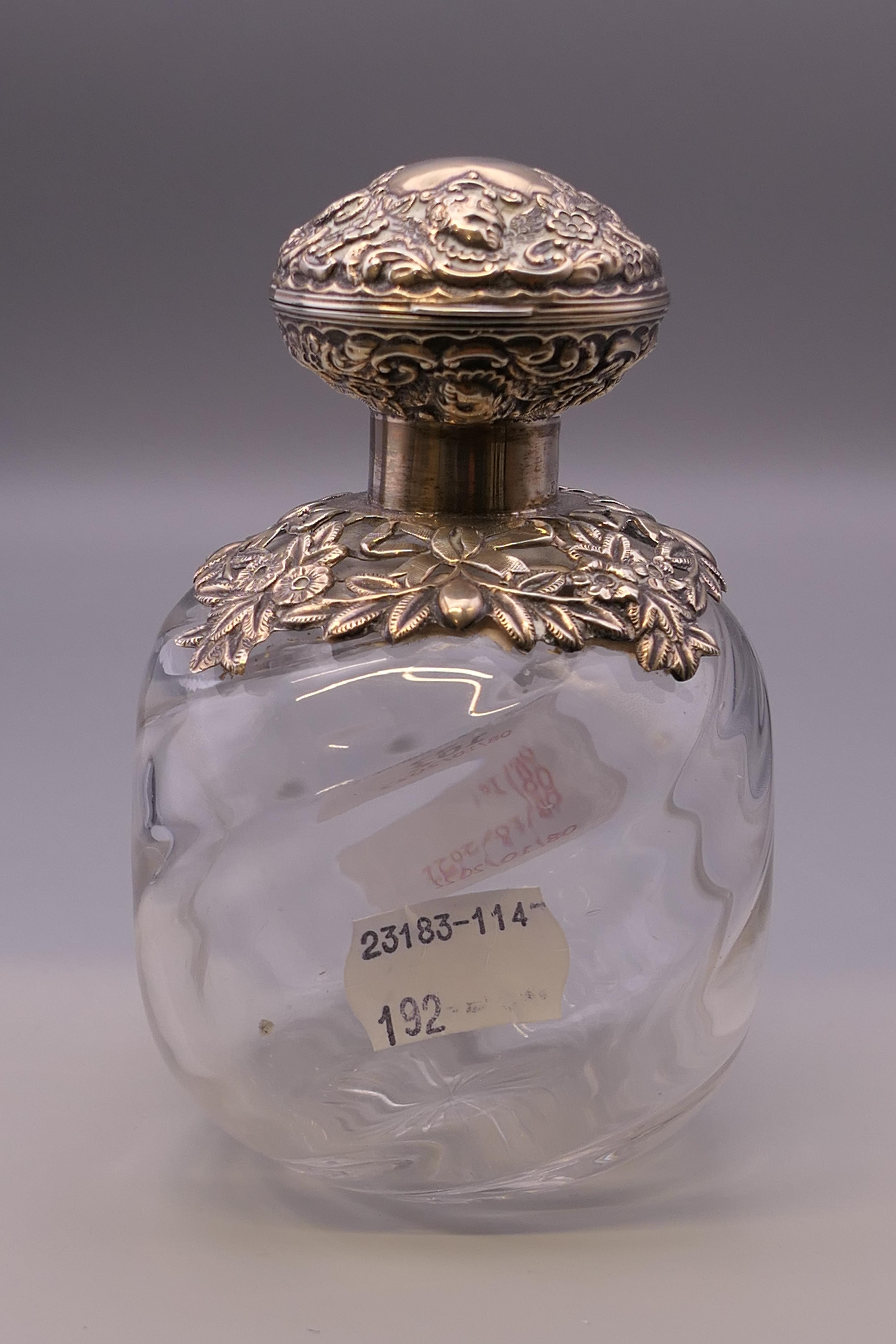 A silver topped bulbous perfume bottle. 12 cm high. - Image 2 of 7