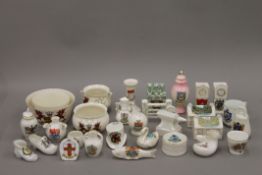 A quantity of crested ware ceramics.