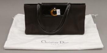 A Christian Dior handbag, with dust bag. 38 cm wide.