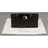 A Christian Dior handbag, with dust bag. 38 cm wide.