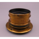 An antique brass bound Cooke camera lens H.D Taylor's Patents Series 111 6.5 x 4.75 EQ focus 7.