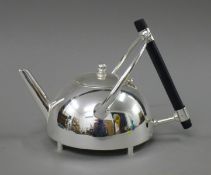 A Christopher Dresser style teapot. 15 cm high.