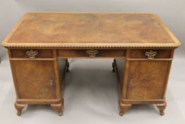 An early 20th century walnut pedestal desk. 150 cm wide x 89 cm deep.