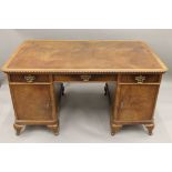 An early 20th century walnut pedestal desk. 150 cm wide x 89 cm deep.