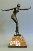 An Art Deco style bronze model of a dancer. 49 cm high.