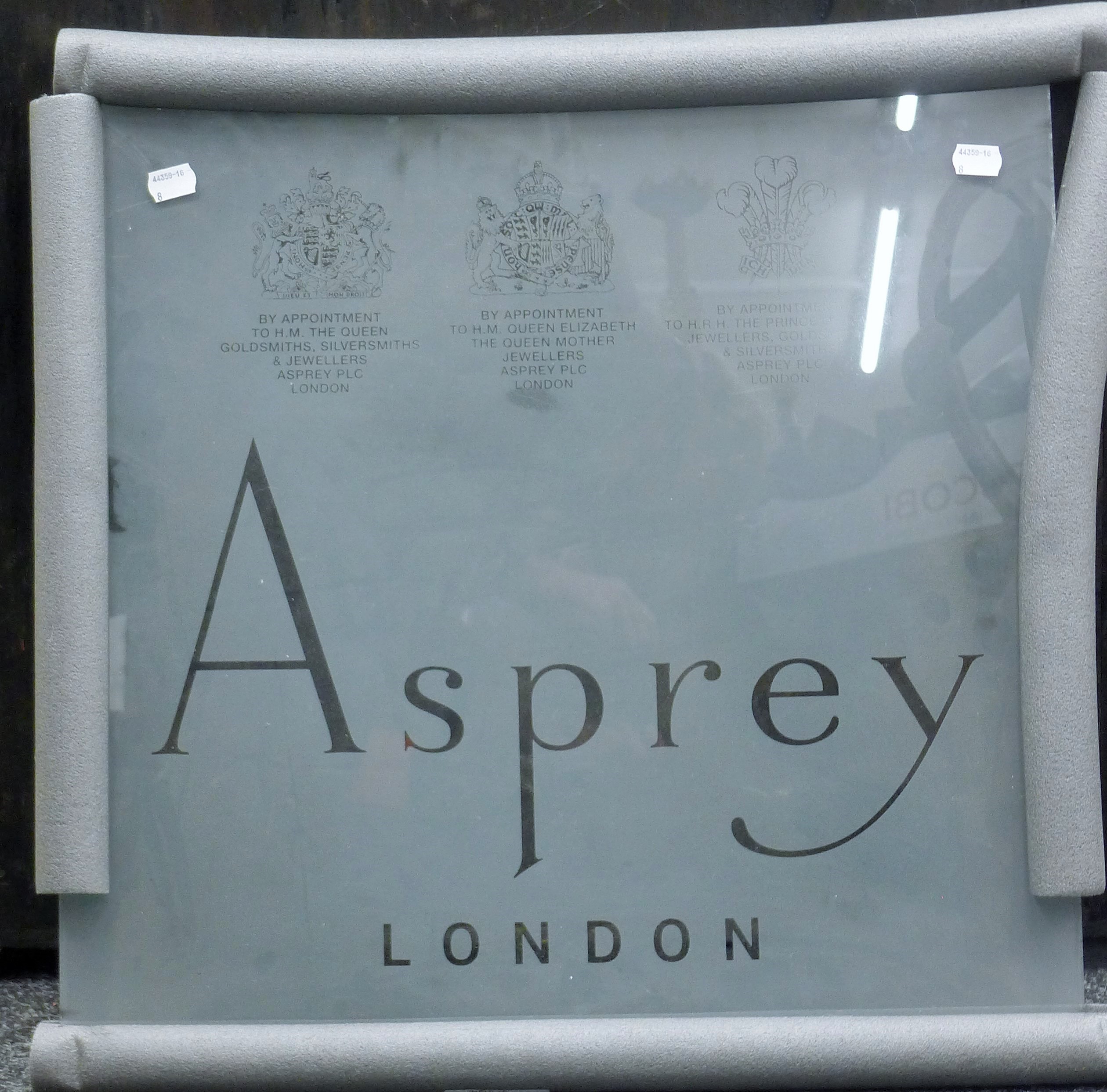 An Asprey etched glass panel and printing screen. The former 53 x 53 cm.