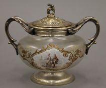 A 19th century French glass and silver plated sugar bowl decorated with figural vignettes. 16.