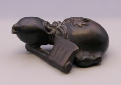 A Chinese bronze water dropper. 6 cm long.