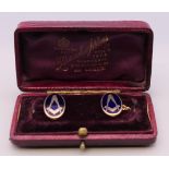 A pair of vintage 9 ct gold enamelled Masonic cufflinks. 11.4 grammes total weight.