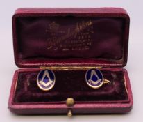 A pair of vintage 9 ct gold enamelled Masonic cufflinks. 11.4 grammes total weight.