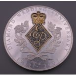 A diamond set pure silver medallion commemorating Queen Elizabeth II and Prince Phillips Diamond