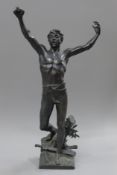 A bronze model of a young man with a sword at his feet. 51 cm high.