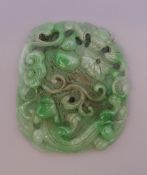 A Chinese apple green jade carving. 8.5 cm long.