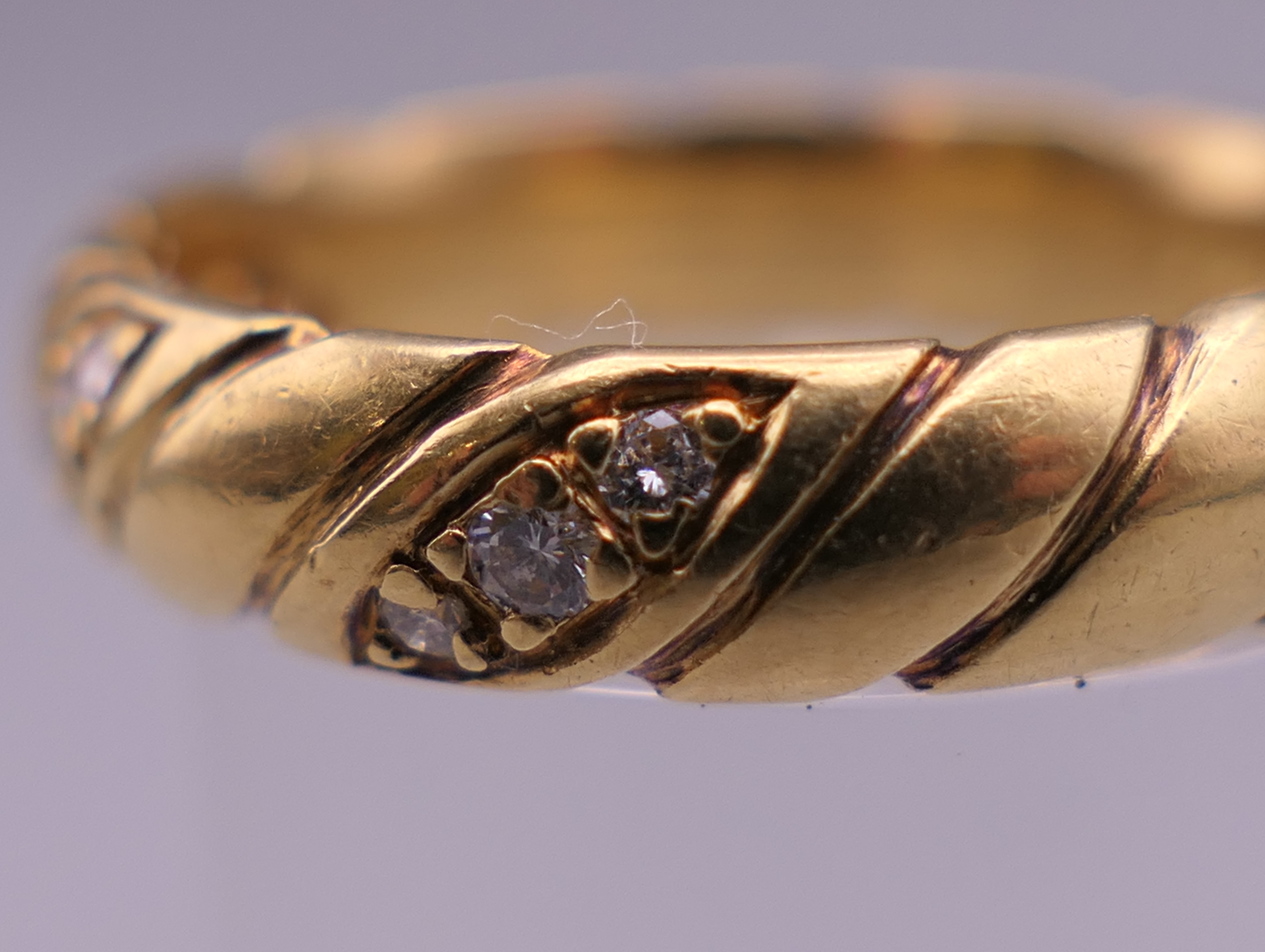 An 18 ct gold diamond set ring. Ring size P. 6.6 grammes total weight. - Image 3 of 10
