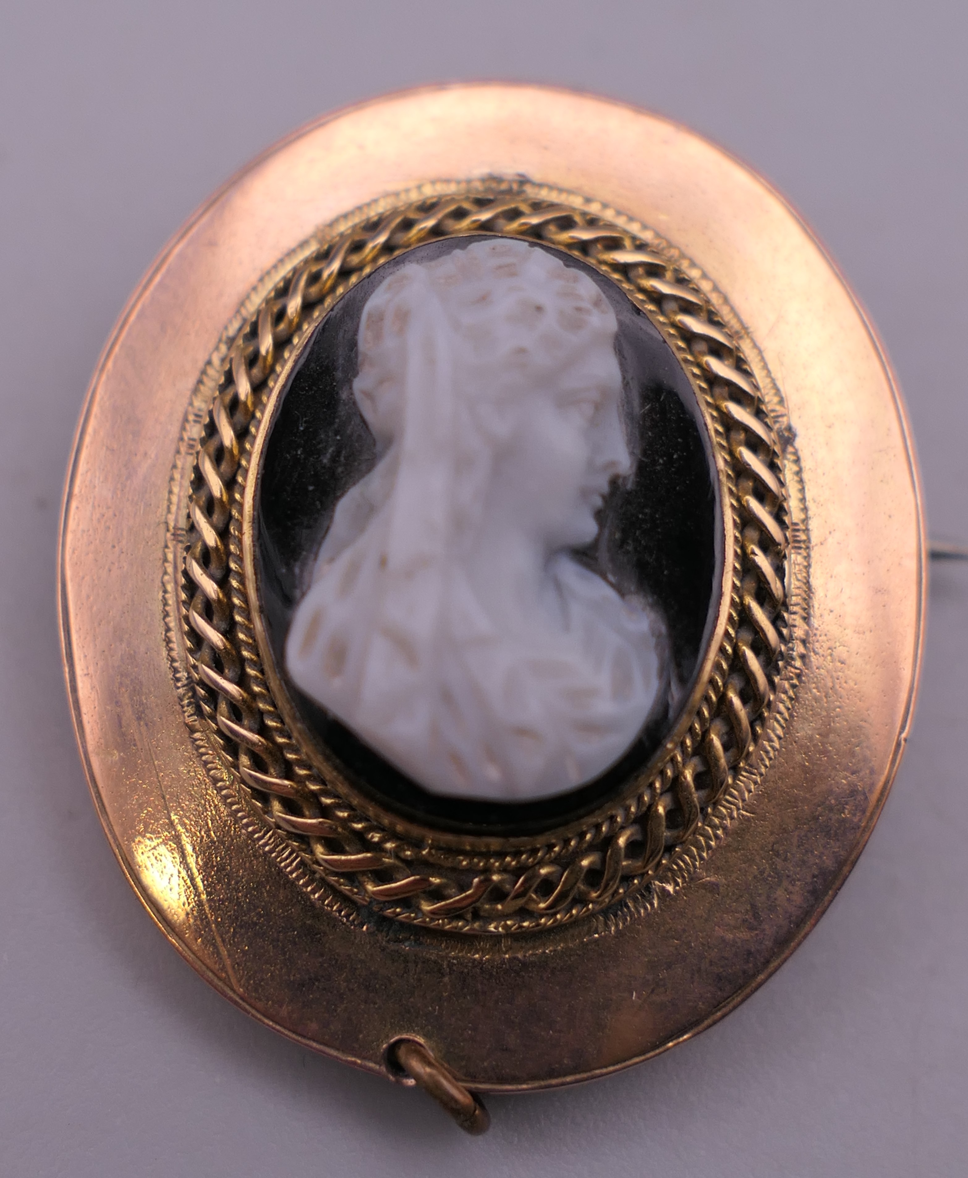 A 19th century hardstone cameo brooch. 3 cm high.