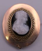 A 19th century hardstone cameo brooch. 3 cm high.