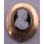 A 19th century hardstone cameo brooch. 3 cm high.