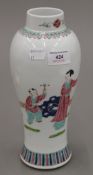 A Chinese famille rose porcelain vase decorated with children in a garden,