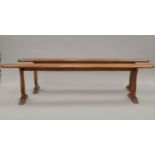A pair of fruitwood benches. 202 cm long.
