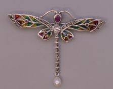 A silver plique a jour dragonfly brooch. 7 cm wide.