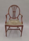 An early 20th century mahogany open armchair with James Shoolbred & Co label. 52 cm wide.