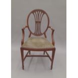 An early 20th century mahogany open armchair with James Shoolbred & Co label. 52 cm wide.