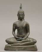 A bronze model of Buddha. 17.5 cm high.