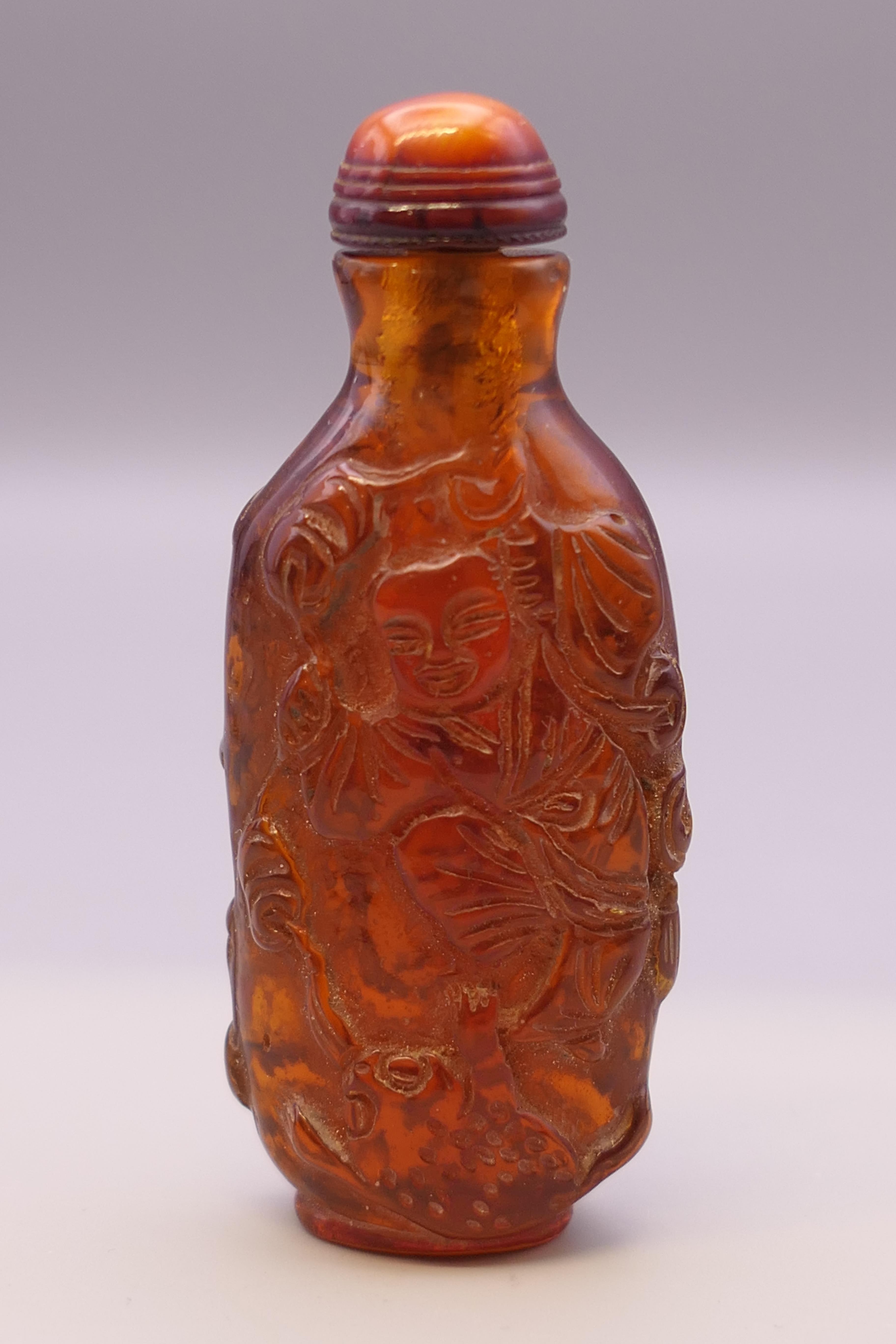 A snuff bottle. 8 cm high.