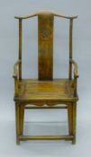 A 19th century Chinese elm chair with carved splat. 59 cm wide.