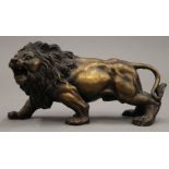 A bronze model of a lion. 17 cm long.