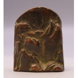 A bronze seal decorated with mountains. 4 cm high.