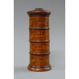 A wooden spice tower. 19.5 cm high.