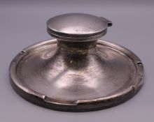 A silver Capstan inkwell. 17.5 cm diameter.