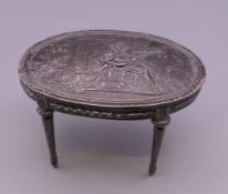A Continental silver model of a table. 8 cm long.
