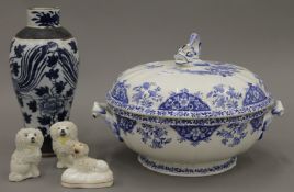 A quantity of porcelain, including three Staffordshire dogs,