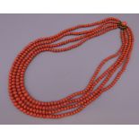 A Victorian four strand coral necklace. 42 cm long.