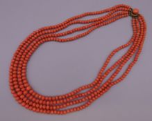 A Victorian four strand coral necklace. 42 cm long.