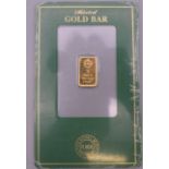 A Royal Mint 1 gram fine gold bar.