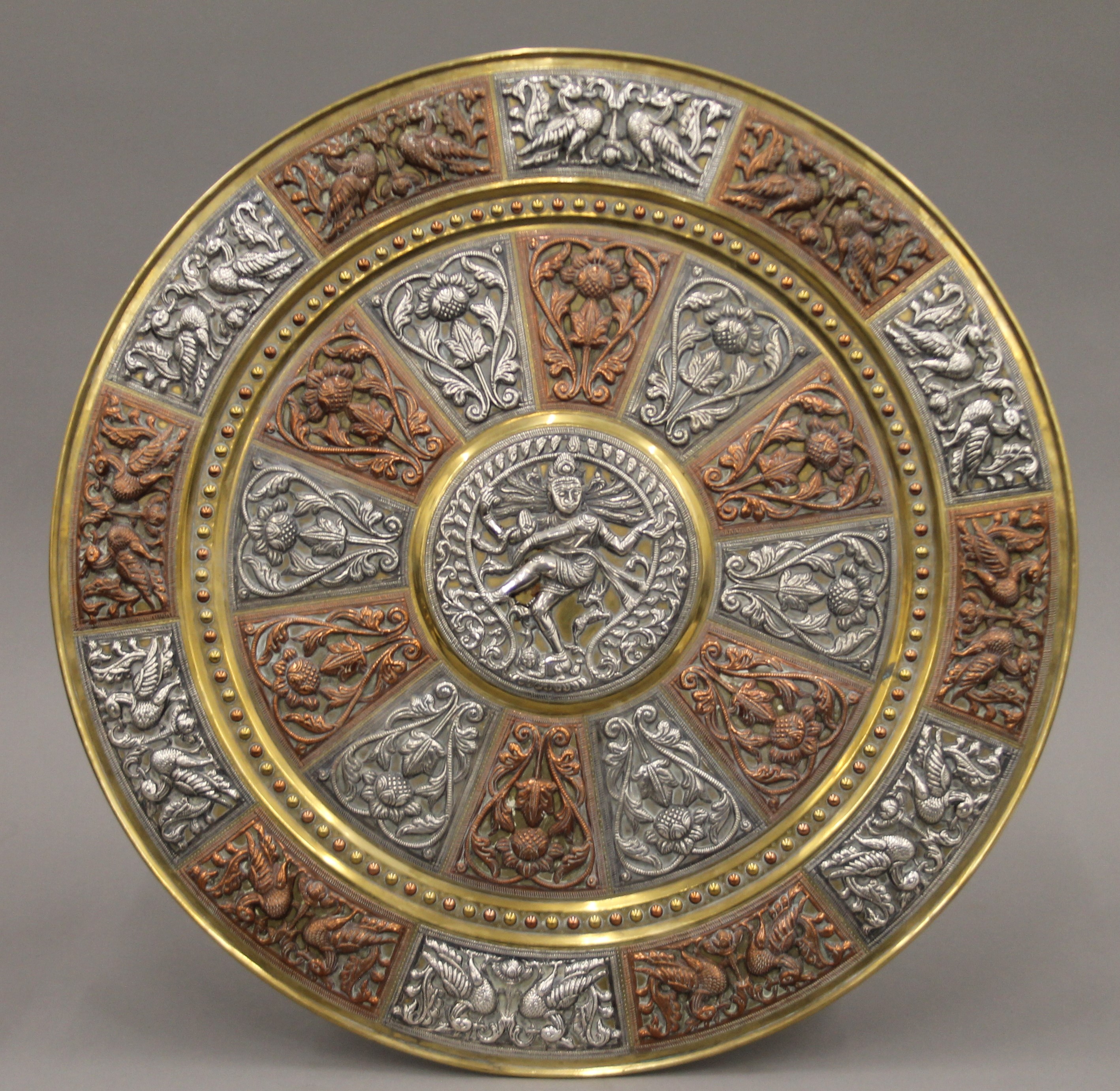 A large Indian mixed metal circular wall hanging. By repute purchased in India Between 1890-1920. - Image 2 of 4