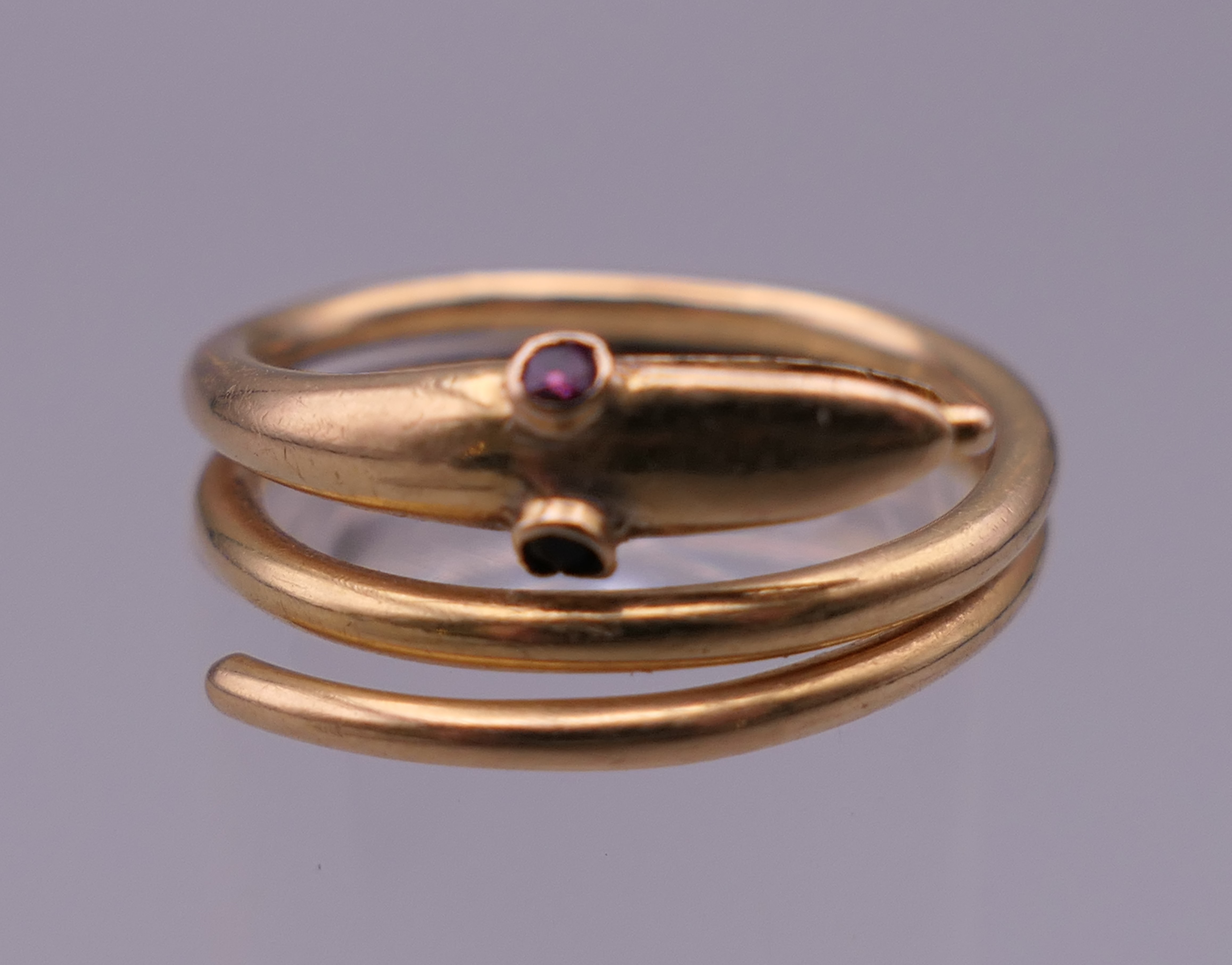 An 18 ct gold snake form ring. Ring size J/K. 5.5 grammes total weight. - Image 2 of 4