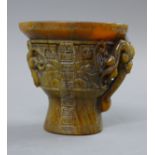 A libation cup. 12 cm high.