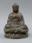 A lacquered bronze model of Buddha. 21 cm high.