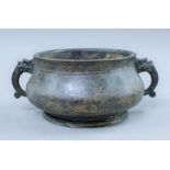 A Chinese bronze censer with silver inlays. 24 cm wide.