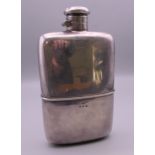 A silver spirit flask. 16 cm high. 308.2 grammes.