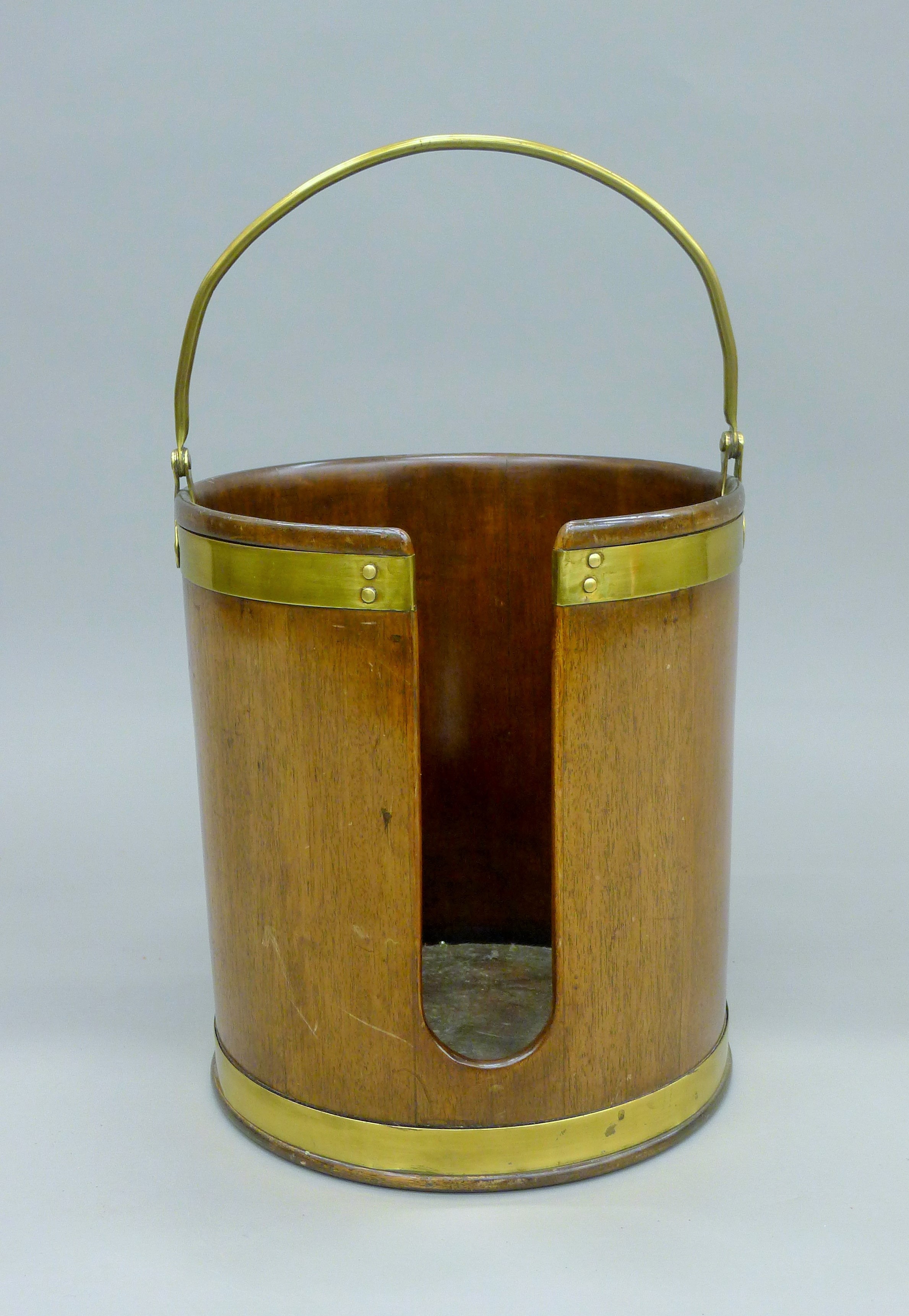 A brass bound mahogany plate bucket. 34 cm high excluding handle.